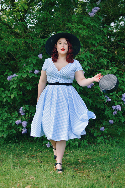 Plus size pinup Miss Amy May models the Hourglass White and Blue Gingham cotton Swing dress by The Pretty Dress Company for a fit and size review