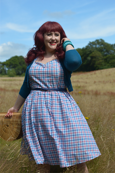 Plus size pinup Miss Amy May models the Sophia Halterneck pink and blue Check dress gifted by Dolly & Dotty for a fit and size review