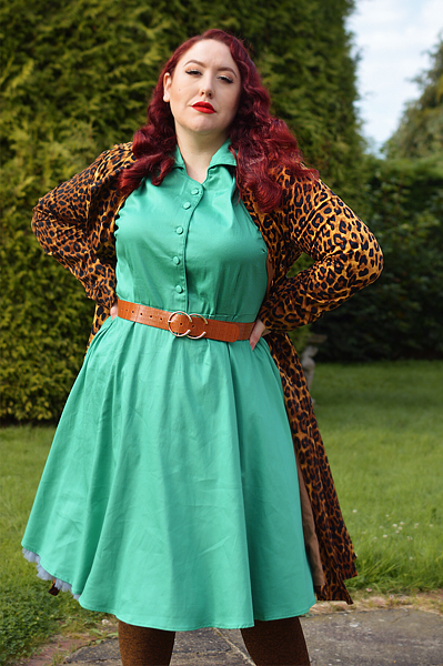 Plus size pinup Miss Amy May models the green Penelope shirt dress gifted by Dolly & Dotty for a fit and size review