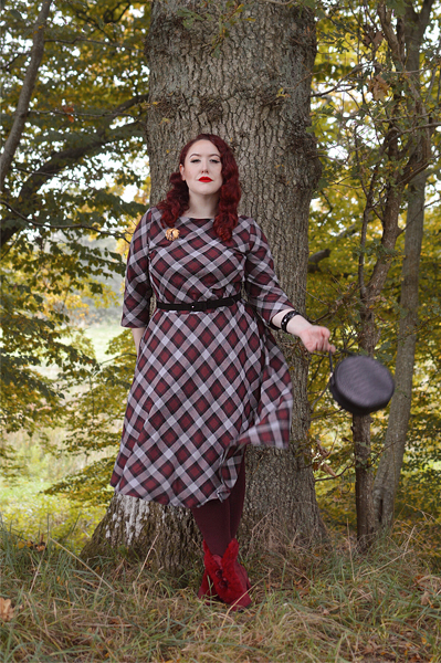 Plus size pinup Miss Amy May models the burgundy and grey plaid Devon swing dress for a fit and sizing review