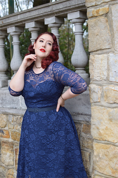 Plus size pinup Miss Amy May models the navy blue Madeline lace dress by Dolly and Dotty for a fit and size review