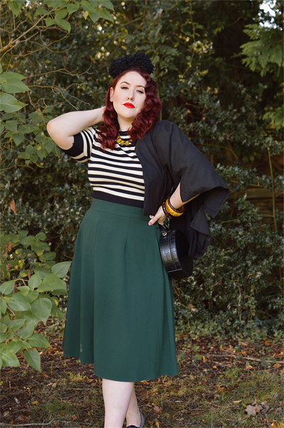 Plus size pinup Miss Amy May models the classic 1940s a-line skirt by Weekend Doll and the black and ivory striped Boatneck sweater by Pretty Retro for a fit and size review