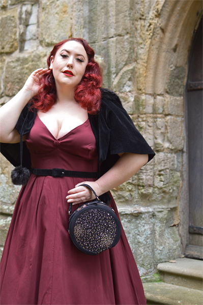 Pinup Miss Amy May models the black sequin Rhea low court heels and black sequin Alberta bag by Ruby Shoo for review