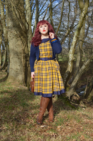 Plus size pinup Miss Amy May models the yellow and navy tartan Cindy circle skirt dress gifted by Dolly & Dotty for a fit and sizing review
