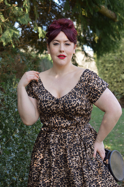 Plus size pinup Miss Amy May models the leopard print off the shoulder Lily dress by Dolly & Dotty for a fit and size review