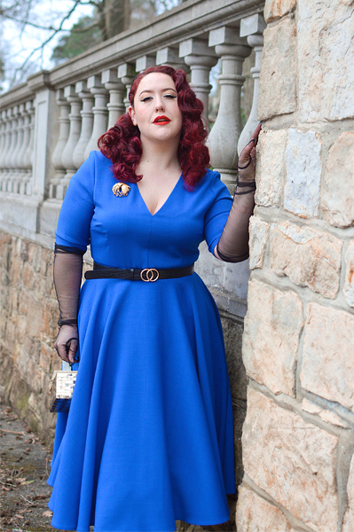 Plus size pinup Miss Amy May models the Myla dress in cobalt blue by The Pretty Dress Company for a fit and size review