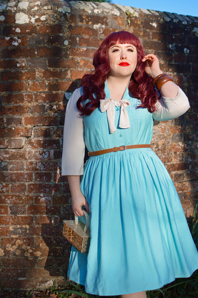 Plus size pinup Miss Amy May models the Cry-Baby dress by Hell Bunny for a fit and size review
