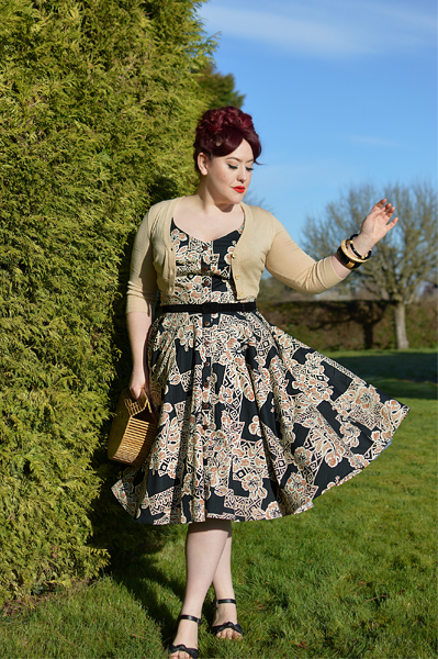 Plus size pinup Miss Amy May models the Dominique 50s dress by Hell Bunny for a fit and size review