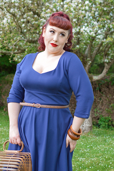 Plus size pinup Miss Amy May models the navy Scarlette dress by Dolly and Dotty for a fit and sizing review
