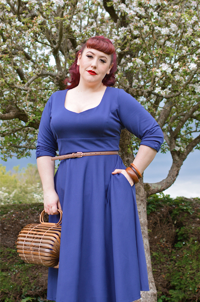 Plus size pinup Miss Amy May models the navy Scarlette dress by Dolly and Dotty for a fit and sizing review